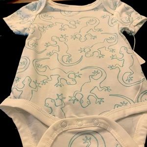 Onesie with lizards on a white background